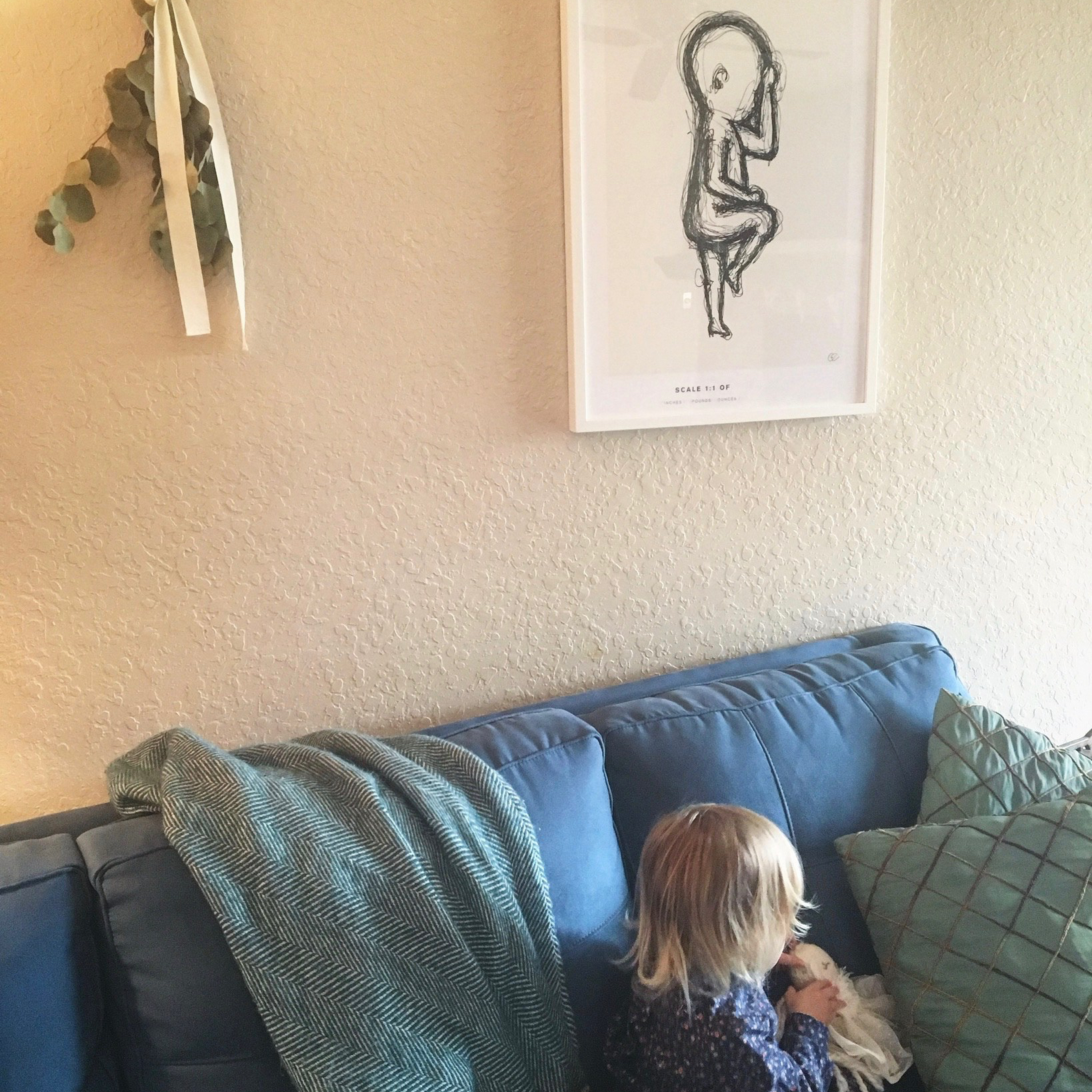 child playing with birth poster